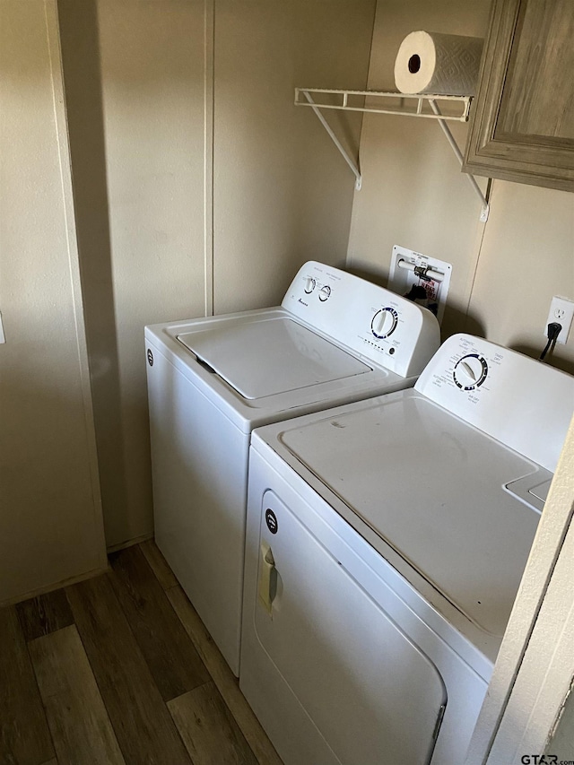 laundry area with washer and clothes dryer and dark hardwood / wood-style flooring