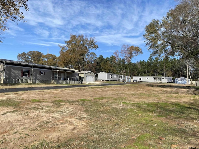 view of yard featuring a garage