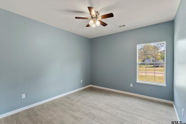 unfurnished room featuring light wood-type flooring and ceiling fan