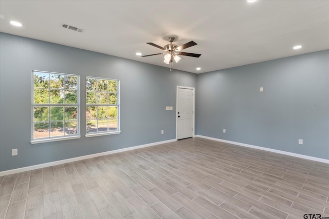 unfurnished room featuring light hardwood / wood-style floors and ceiling fan