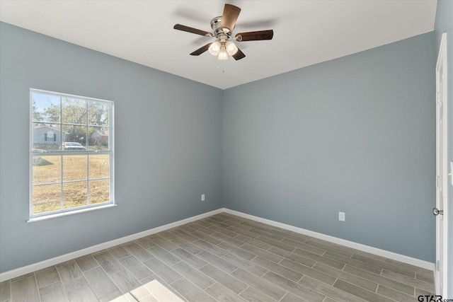 spare room with wood-type flooring and ceiling fan