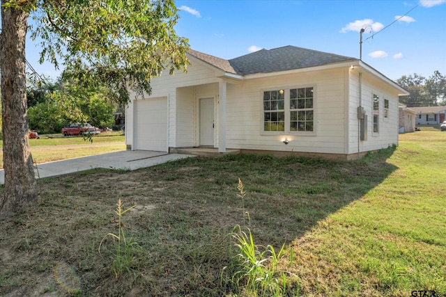 ranch-style house featuring a front yard and a garage