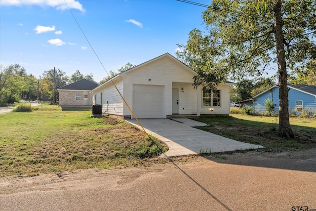 ranch-style home featuring a garage, central AC, and a front yard