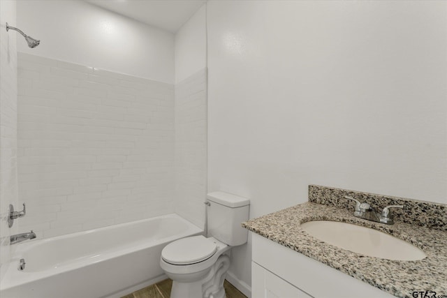 full bathroom featuring vanity, toilet, and tiled shower / bath