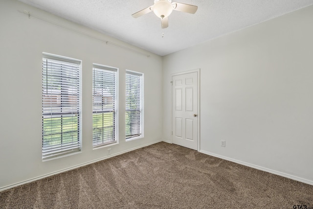 6214 Huntington Dr, Tyler, TX 75703 - unfurnished room featuring carpet, ceiling fan, baseboards, and a textured ceiling