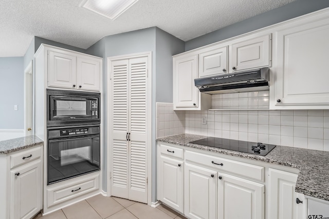 6214 Huntington Dr, Tyler, TX 75703 - kitchen with black appliances, under cabinet range hood, white cabinetry, tasteful backsplash, and a textured ceiling