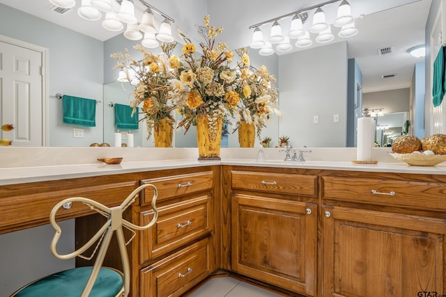 bathroom with visible vents, tile patterned floors, and vanity