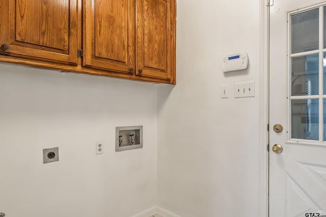 6214 Huntington Dr, Tyler, TX 75703 - laundry room with washer hookup, cabinet space, hookup for an electric dryer, and baseboards