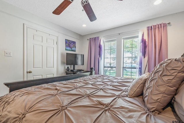 bedroom with recessed lighting, a textured ceiling, and a ceiling fan
