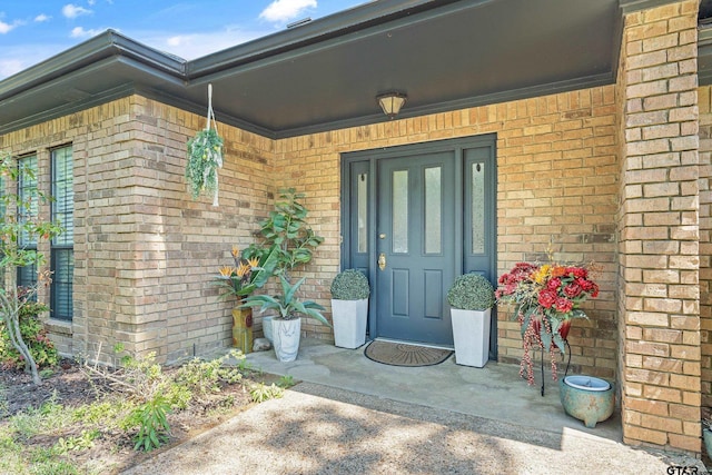 entrance to property with brick siding