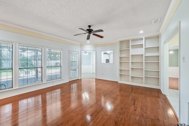 6214 Huntington Dr, Tyler, TX 75703 - unfurnished living room with a textured ceiling, a ceiling fan, ornamental molding, and wood finished floors