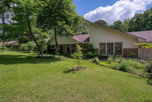 19543 Meadowood Ln, Tyler, TX 75703 - view of front of property featuring brick siding, a front lawn, and roof with shingles