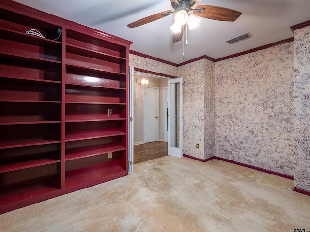 19543 Meadowood Ln, Tyler, TX 75703 - unfurnished bedroom with ornamental molding, wallpapered walls, carpet floors, baseboards, and ceiling fan
