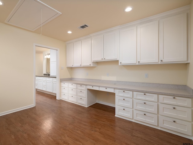 19543 Meadowood Ln, Tyler, TX 75703 - unfurnished office featuring attic access, built in desk, dark wood-style flooring, recessed lighting, and baseboards