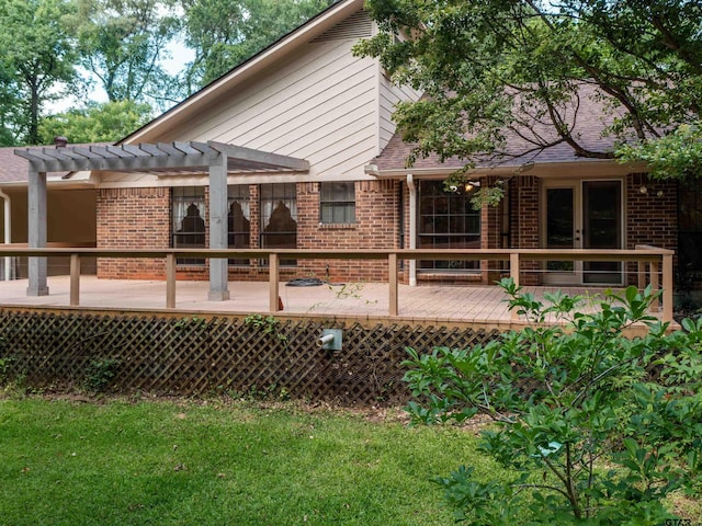 19543 Meadowood Ln, Tyler, TX 75703 - rear view of property with brick siding, a deck, a pergola, and a lawn