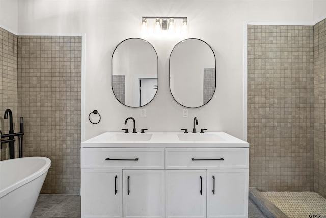 1314 N Queen St, Palestine, TX 75803 - bathroom featuring a tile shower, double vanity, a freestanding tub, and a sink