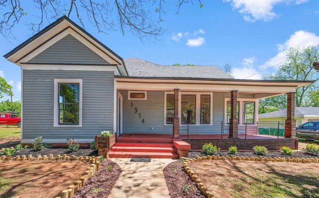 1314 N Queen St, Palestine, TX 75803 - view of front of home with roof with shingles and a porch