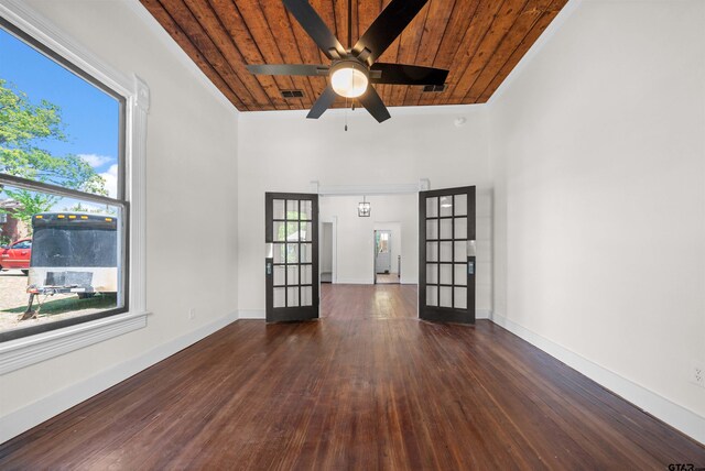 1314 N Queen St, Palestine, TX 75803 - empty room with dark wood finished floors, a ceiling fan, visible vents, wooden ceiling, and baseboards