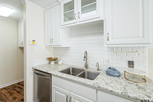 5401 Hollytree Dr, Tyler, TX 75703 - kitchen featuring a sink, stainless steel dishwasher, decorative backsplash, white cabinetry, and ornamental molding