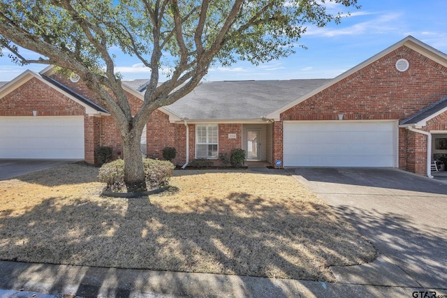5401 Hollytree Dr, Tyler, TX 75703 - view of front facade with brick siding, driveway, and a shingled roof