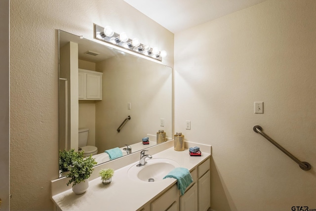 5401 Hollytree Dr, Tyler, TX 75703 - bathroom with vanity and toilet