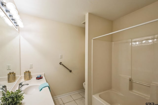 5401 Hollytree Dr, Tyler, TX 75703 - full bathroom featuring tile patterned floors, toilet, vanity, shower / tub combination, and baseboards