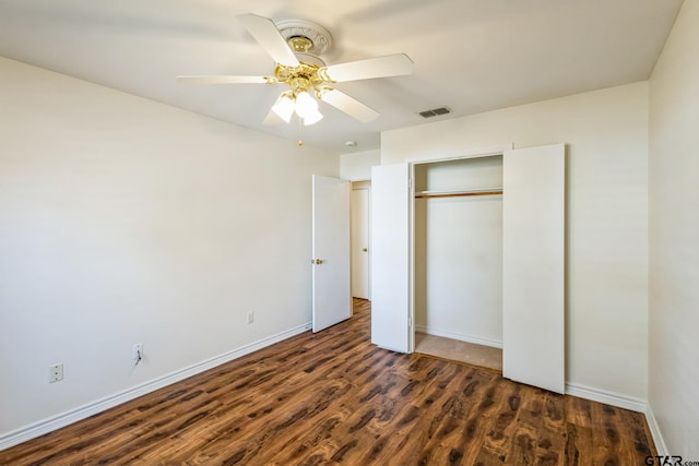 5401 Hollytree Dr, Tyler, TX 75703 - unfurnished bedroom featuring wood finished floors, a closet, a ceiling fan, and baseboards
