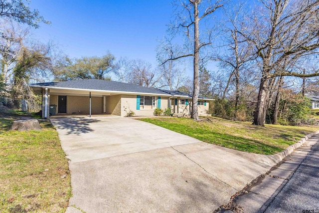 ranch-style home with a front lawn and a carport