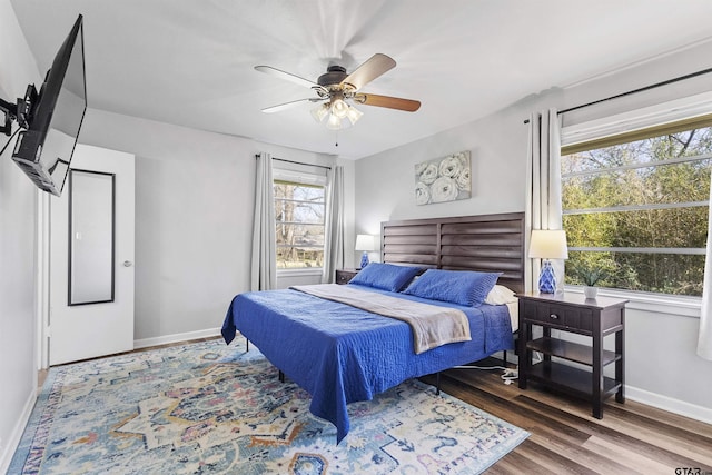 bedroom with ceiling fan and wood-type flooring