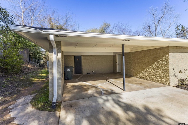 view of vehicle parking featuring a carport