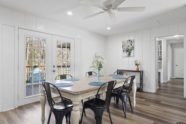 dining room with ceiling fan, ornamental molding, dark wood-type flooring, and french doors