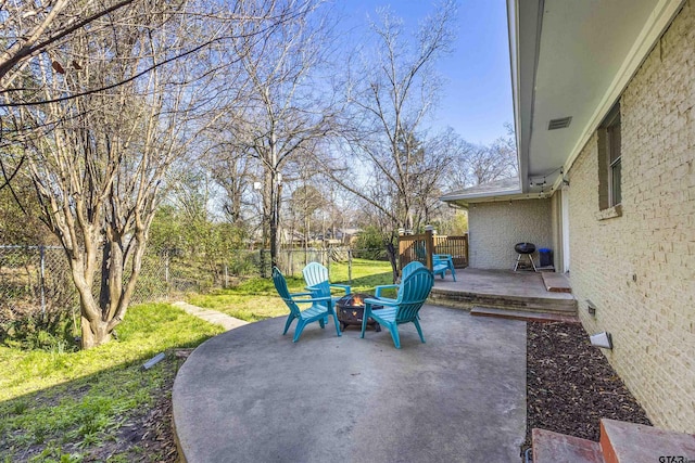 view of patio / terrace with a fire pit