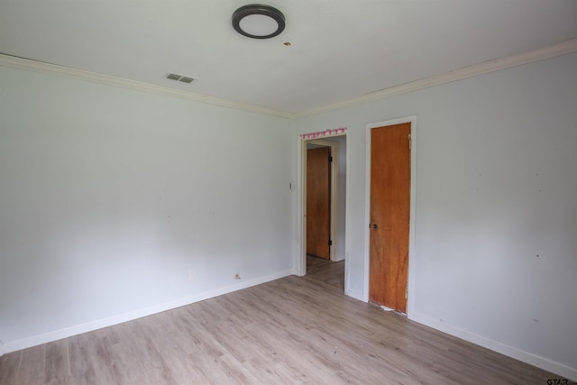 100 Mills St, Arp, TX 75750 - spare room with crown molding, wood finished floors, and baseboards