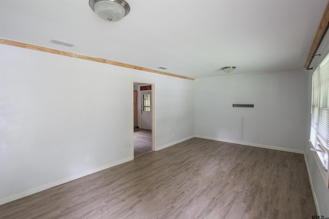 100 Mills St, Arp, TX 75750 - spare room with wood finished floors and baseboards
