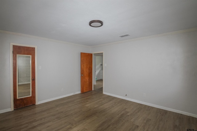 100 Mills St, Arp, TX 75750 - spare room with dark wood finished floors, ornamental molding, and baseboards