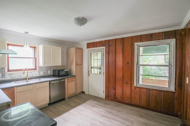 100 Mills St, Arp, TX 75750 - kitchen with stainless steel dishwasher, a sink, black microwave, decorative backsplash, and light wood-style flooring
