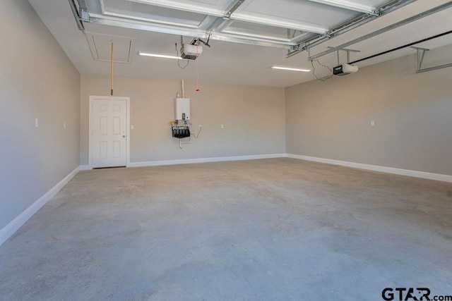 garage with a garage door opener and baseboards