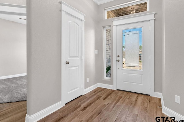 entryway featuring wood finished floors and baseboards