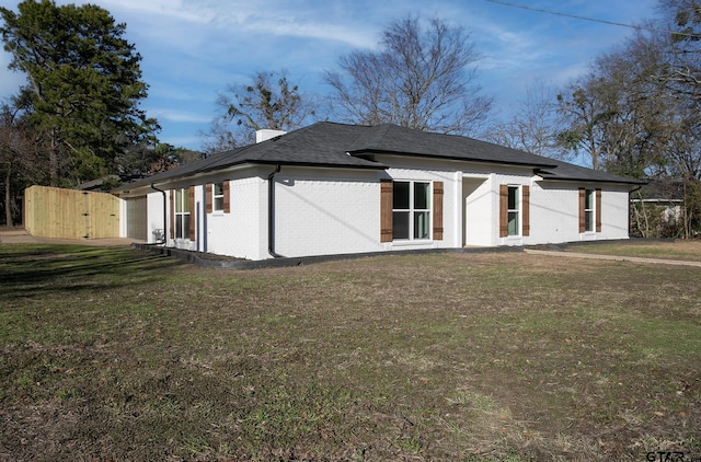 view of home's exterior featuring a lawn