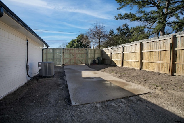 view of yard featuring a patio and central AC unit