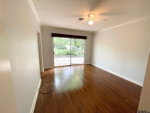 1106 E Redbud, Crockett, TX 75835 - spare room with dark wood-style floors, ornamental molding, and a ceiling fan