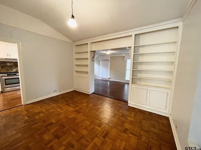 1106 E Redbud, Crockett, TX 75835 - unfurnished bedroom featuring baseboards and vaulted ceiling