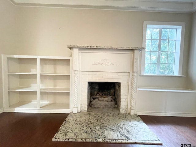 1106 E Redbud, Crockett, TX 75835 - detailed view of wood finished floors and a brick fireplace