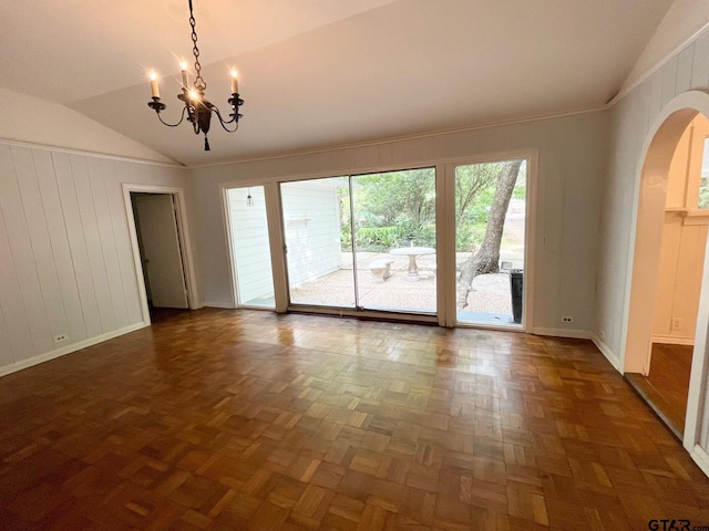 1106 E Redbud, Crockett, TX 75835 - unfurnished room featuring arched walkways, lofted ceiling, and a chandelier