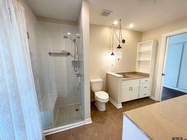 1106 E Redbud, Crockett, TX 75835 - full bathroom with vanity, a stall shower, tile patterned floors, and recessed lighting