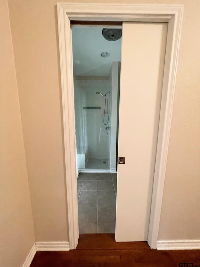 1106 E Redbud, Crockett, TX 75835 - corridor with baseboards and dark wood-style flooring