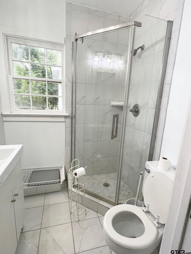 1106 E Redbud, Crockett, TX 75835 - full bathroom featuring marble finish floors, a shower stall, and vanity