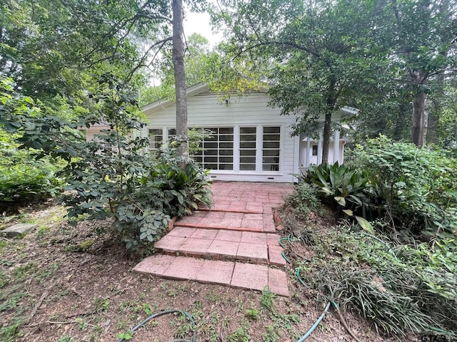 1106 E Redbud, Crockett, TX 75835 - rear view of property featuring a patio area