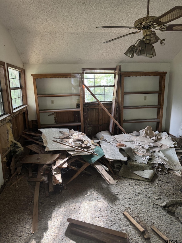 107 Acorn Dr, Marshall, TX 75670 - miscellaneous room with a textured ceiling, ceiling fan, and vaulted ceiling