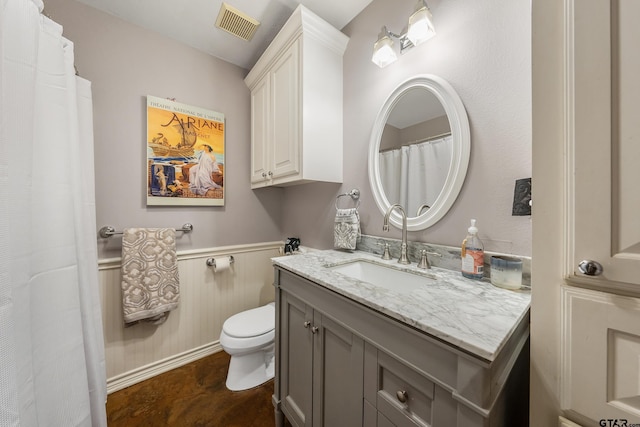 bathroom with hardwood / wood-style floors, vanity, and toilet